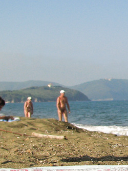 On a nudist beach